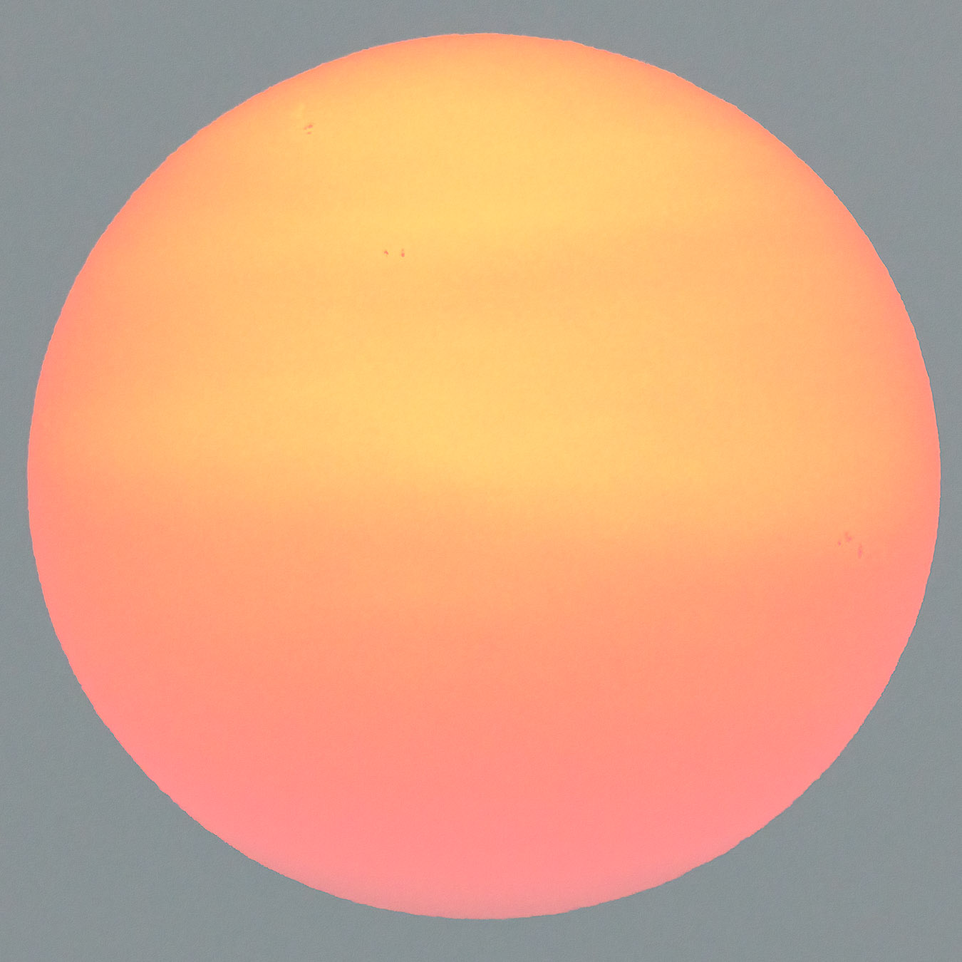 Sunset and sunspots through smoky, hazy sky